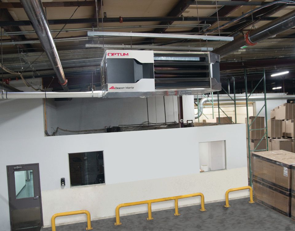 Optum unit heater hanging from the ceiling in a garage 